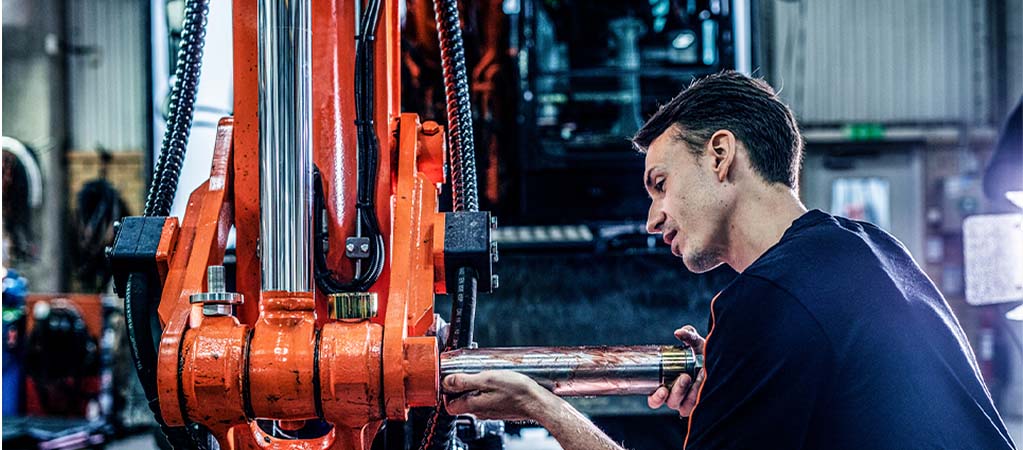 Maintenance technician installing Expander System pivot pin 2